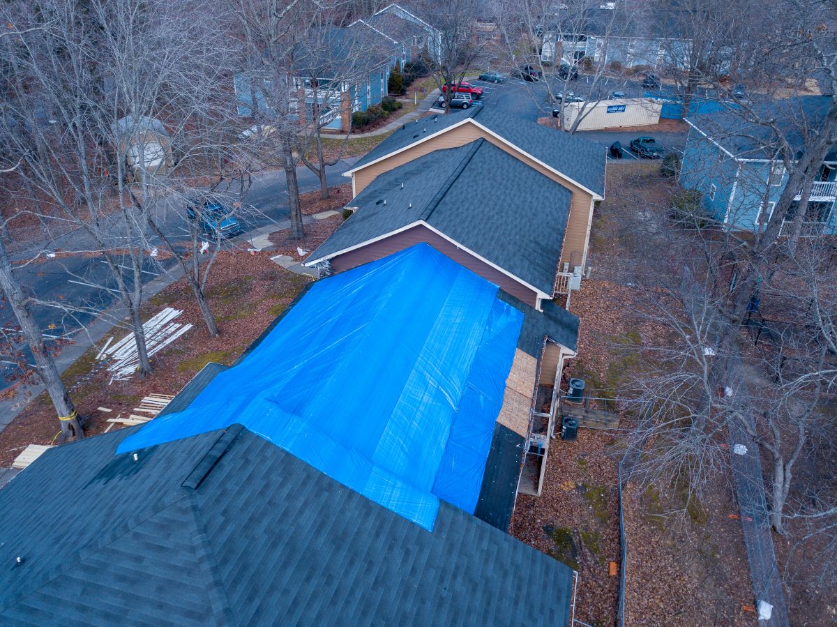 tarp covering house after storm