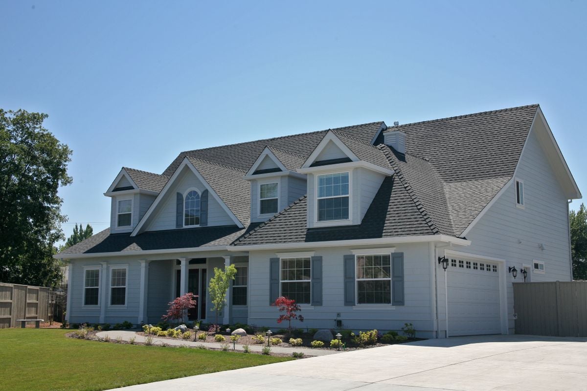 white sidings big house shingles roof