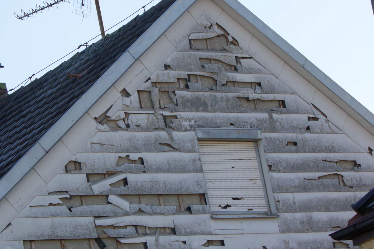 white sidings damaged after storm big house