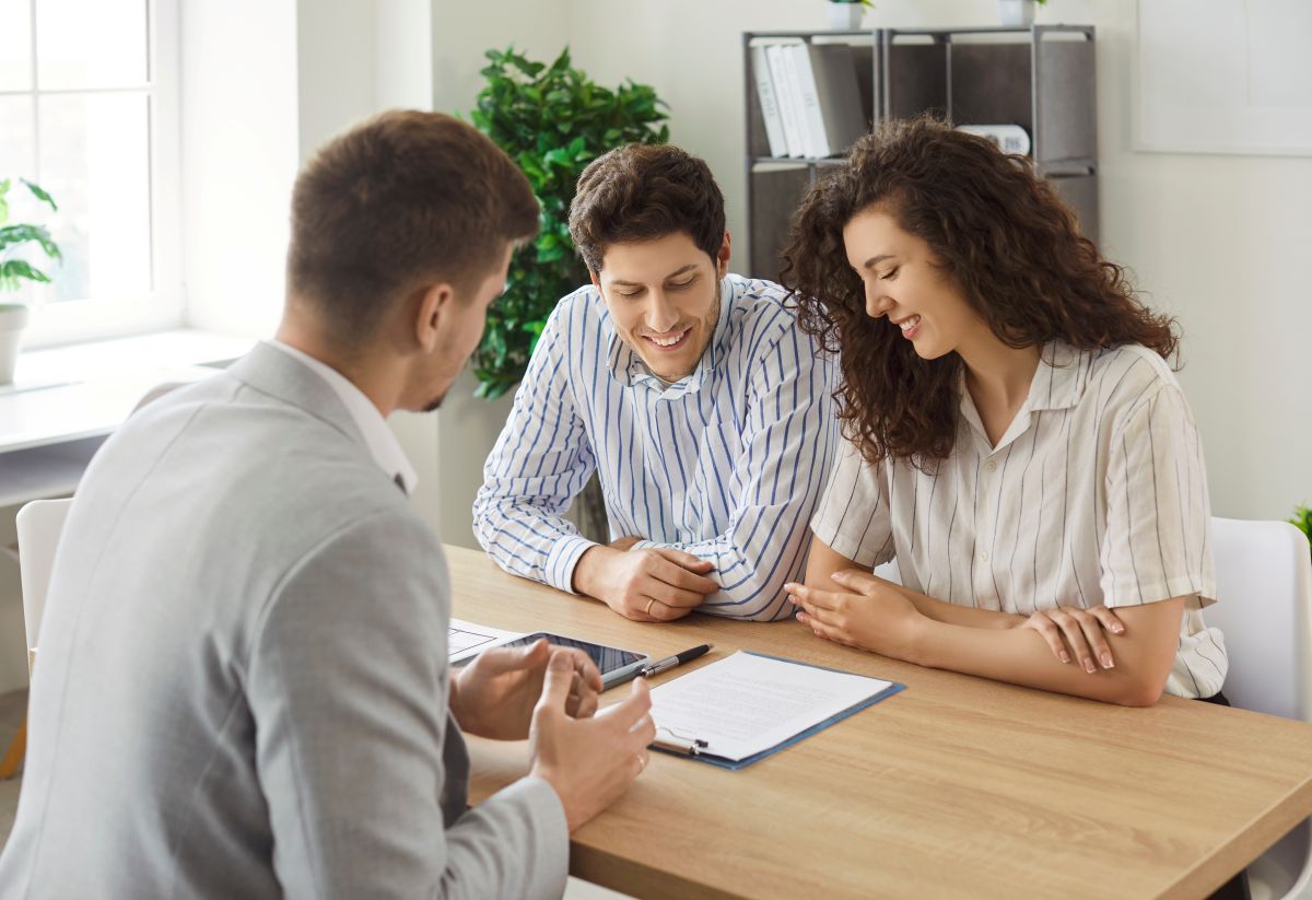 young couple talking with consultant