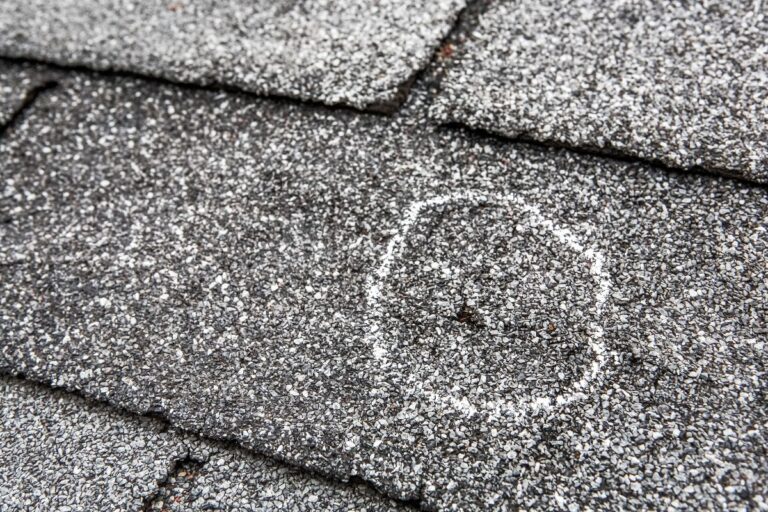 close-up view of shingle damage after hail storm