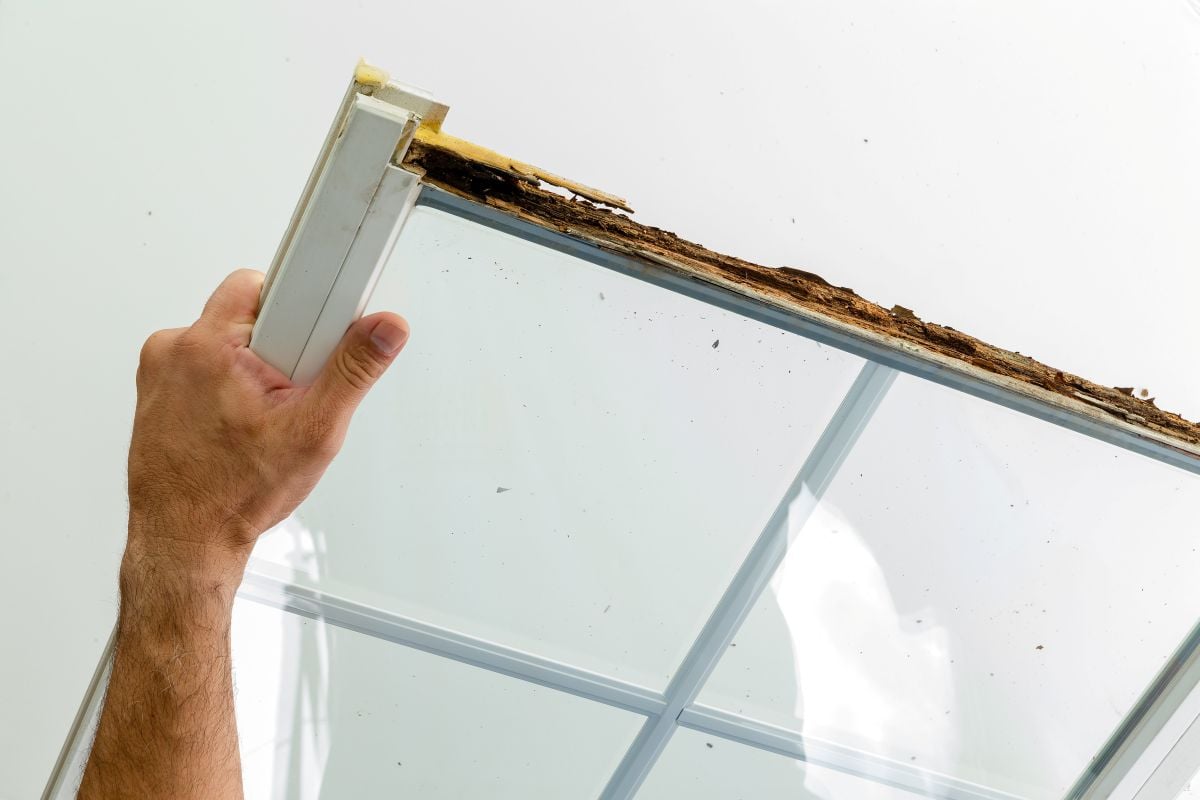 how to replace a window hand holding damaged window