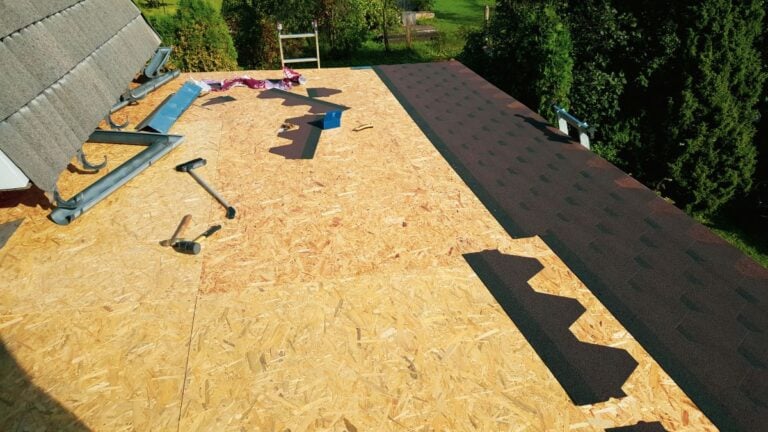 Installing asphalt roofing shingles, work in progress. Roof repair and installation