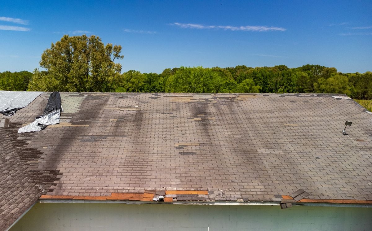 Roof missing shingles from weather and storm damage